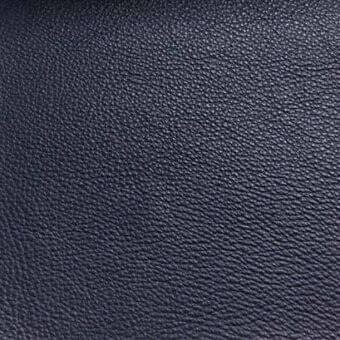 Dark blue Rugiano S5016 leather rug close-up displaying a smooth, dense texture with consistent color and subtle tonal variations.